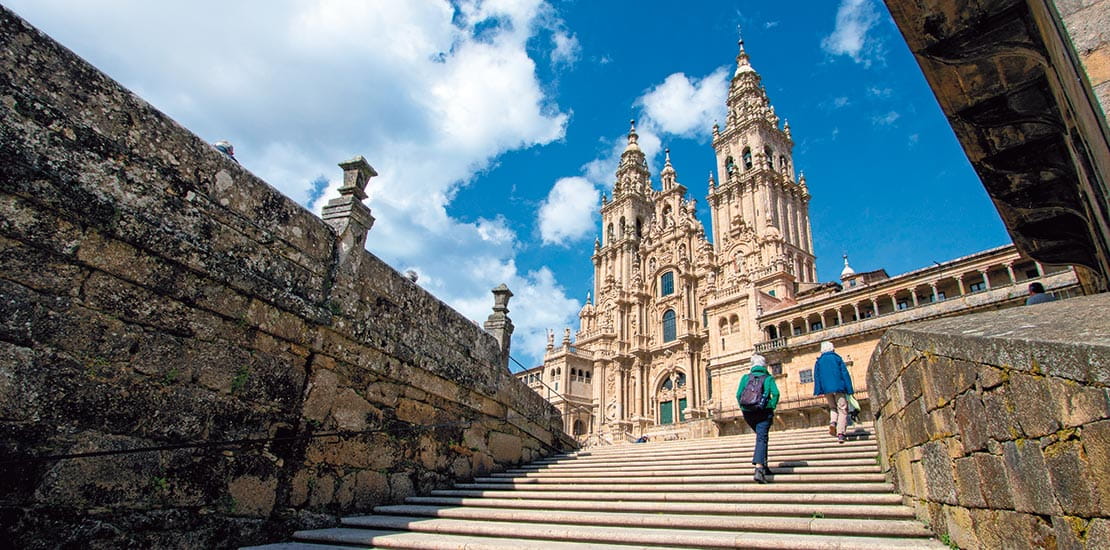 People walking up steps of Santiago de Compostela in Spain
